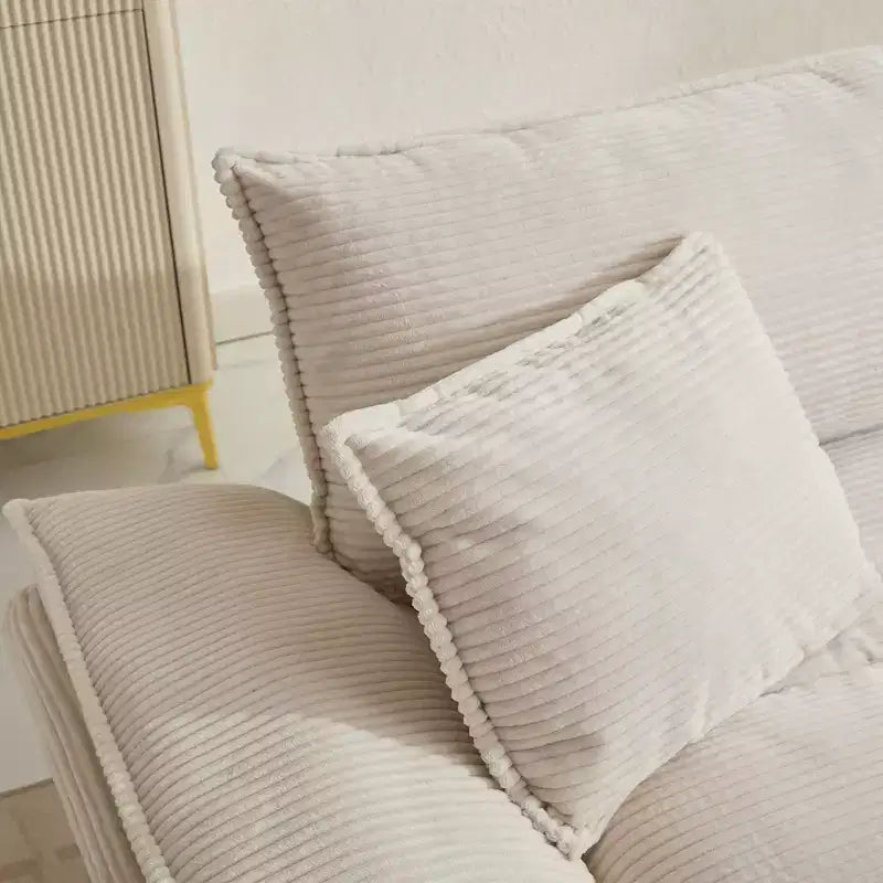 Canapé-lit confortable en velours côtelé avec oreillers